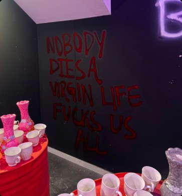 Graffiti wall and breakables inside the Breaking Point room